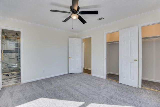 unfurnished bedroom with crown molding, ceiling fan, carpet flooring, and ensuite bath