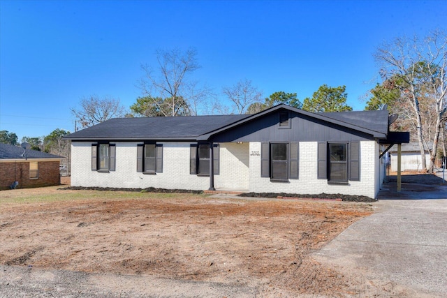 ranch-style home with a carport