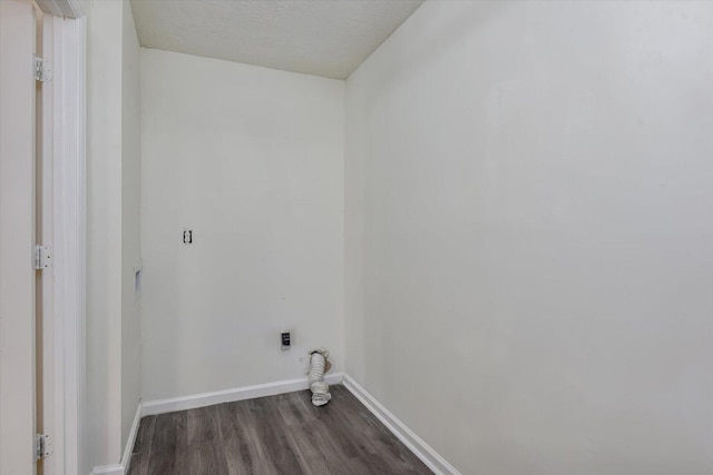 laundry room with dark wood-type flooring and hookup for an electric dryer