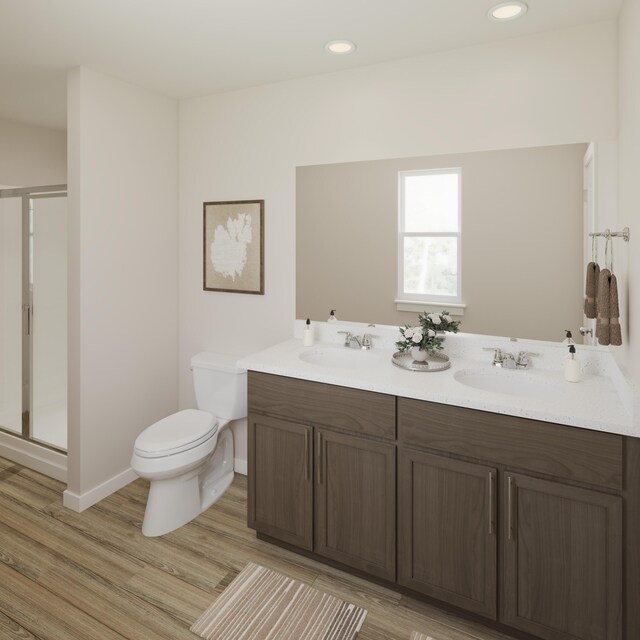 772 Count Fleet Ct, Graniteville, SC 29829 - full bathroom featuring a stall shower, wood finished floors, toilet, and a sink
