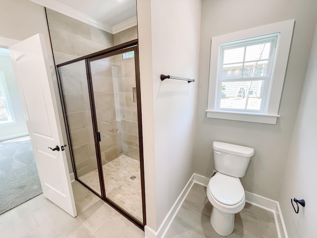 full bathroom featuring toilet, baseboards, a shower stall, and crown molding