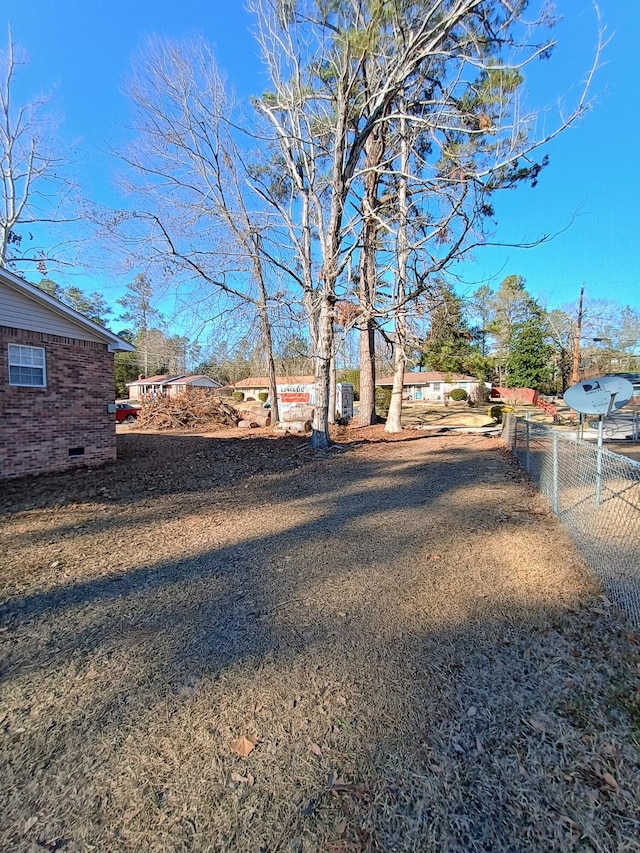 view of yard with fence