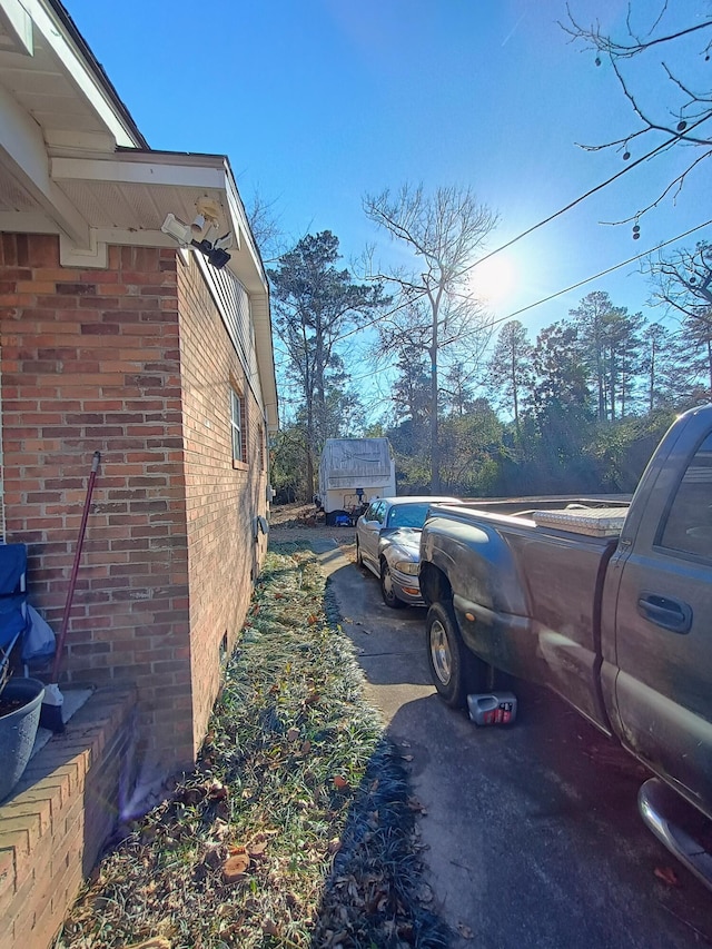 view of home's exterior with brick siding