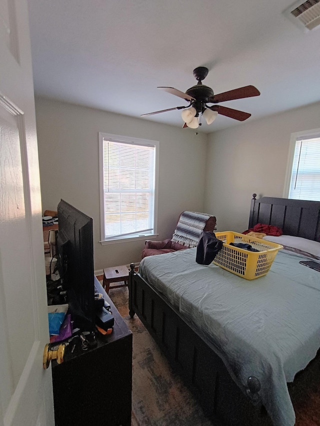 bedroom featuring visible vents and ceiling fan