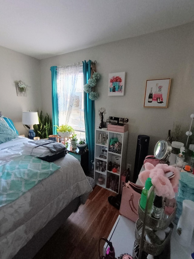 bedroom with wood finished floors