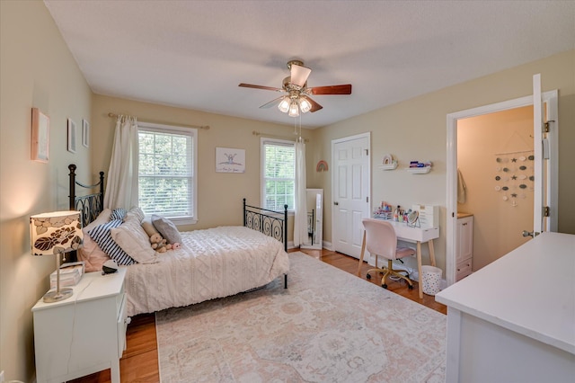 bedroom featuring ceiling fan and wood finished floors