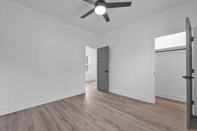 1017 Miller St, Augusta, GA 30901 - unfurnished bedroom with wood finished floors, baseboards, and a ceiling fan