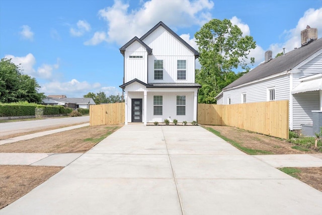 1017 Miller St, Augusta, GA 30901 - view of front of home featuring driveway, fence, a gate, and board and batten siding