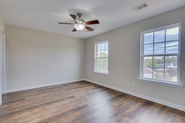 unfurnished room featuring dark hardwood / wood-style flooring and ceiling fan