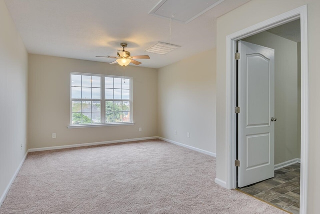 unfurnished room with ceiling fan and light colored carpet