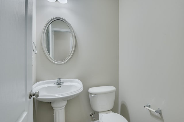 bathroom featuring toilet