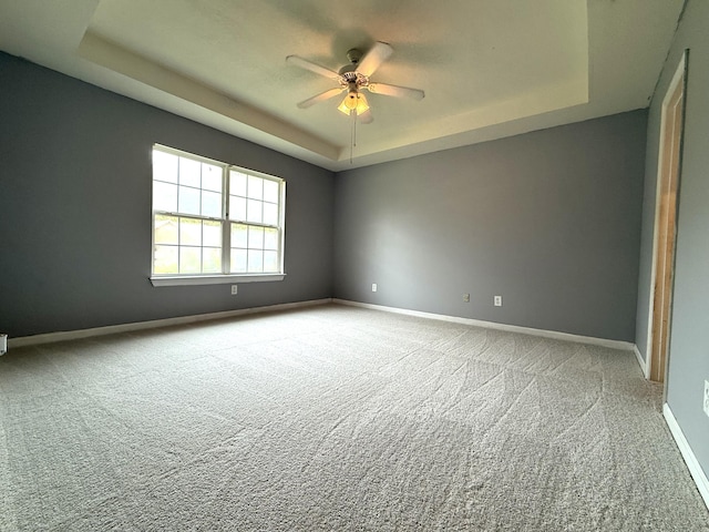 1420 Sawmill Trl, Grovetown, GA 30813 - carpeted spare room with a raised ceiling, a ceiling fan, and baseboards