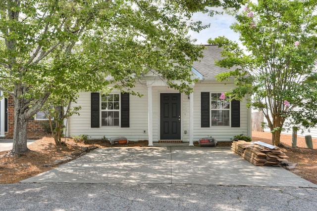 1532 Abby Way, Augusta, GA 30909 - view of property hidden behind natural elements with a shingled roof and a porch