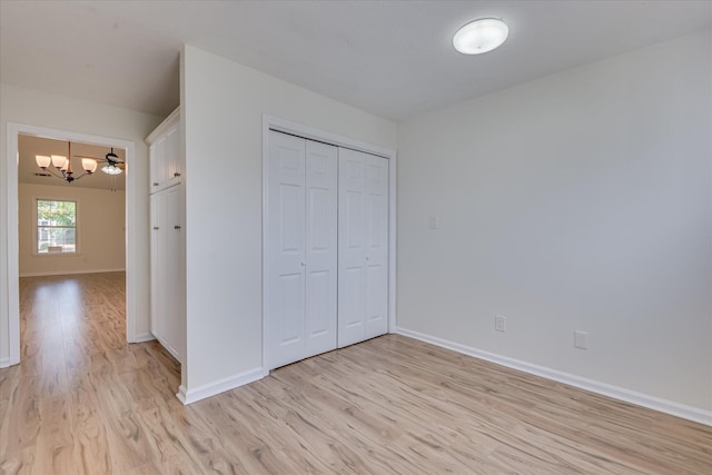 1532 Abby Way, Augusta, GA 30909 - unfurnished bedroom featuring a chandelier, light wood-style floors, and a closet