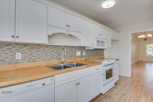 1532 Abby Way, Augusta, GA 30909 - kitchen featuring white appliances, white cabinetry, light countertops, and a chandelier