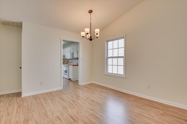 1532 Abby Way, Augusta, GA 30909 - unfurnished room featuring a chandelier, light wood finished floors, and lofted ceiling