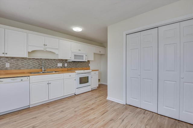 1532 Abby Way, Augusta, GA 30909 - kitchen with white appliances, tasteful backsplash, light wood-style floors, light countertops, and white cabinetry