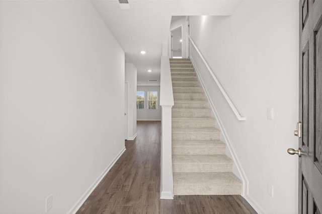 stairway featuring hardwood / wood-style floors