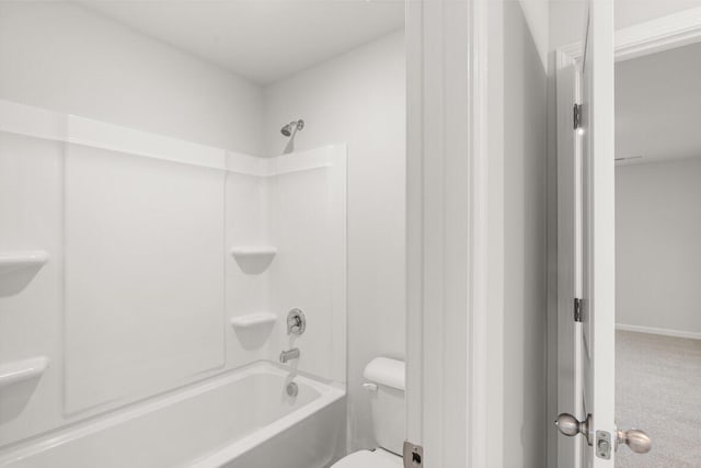 bathroom with toilet and tub / shower combination