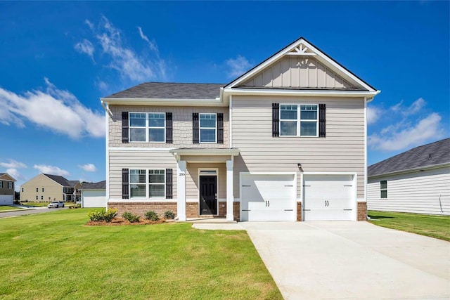 craftsman house featuring a front lawn and a garage