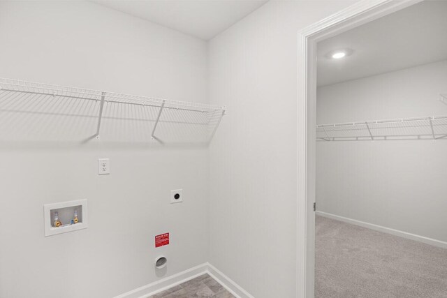 laundry area with carpet flooring, washer hookup, and hookup for an electric dryer