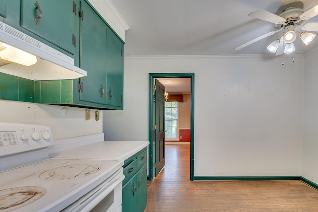 413 Mcintosh Dr, Waynesboro, GA 30830 - kitchen featuring white range oven, under cabinet range hood, green cabinets, crown molding, and wood finished floors