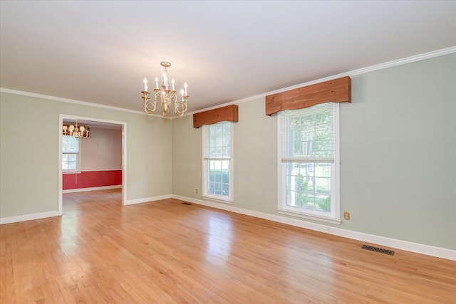 413 Mcintosh Dr, Waynesboro, GA 30830 - unfurnished room with a chandelier, crown molding, light wood finished floors, and baseboards