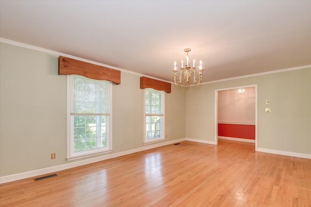 413 Mcintosh Dr, Waynesboro, GA 30830 - spare room featuring a chandelier, light wood-style flooring, baseboards, and ornamental molding