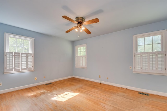 413 Mcintosh Dr, Waynesboro, GA 30830 - spare room with healthy amount of natural light, wood finished floors, and baseboards