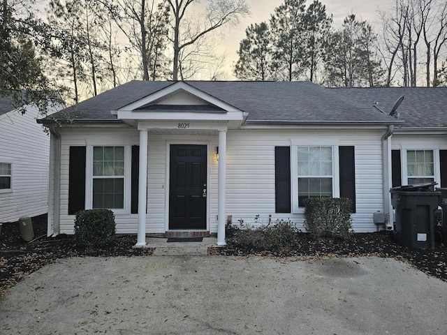 view of front of property with roof with shingles