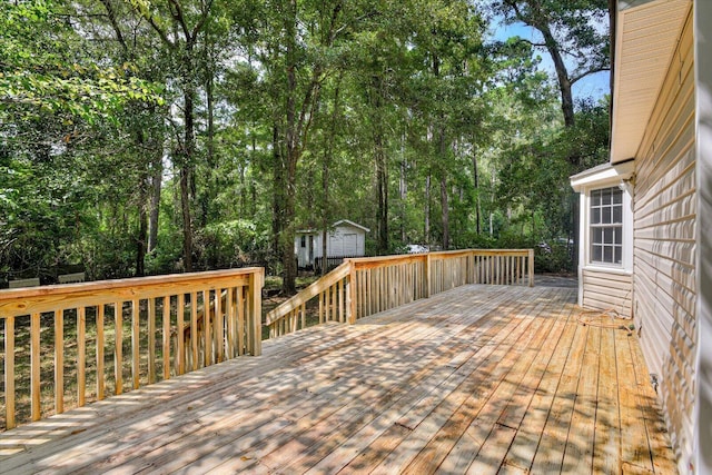 wooden deck featuring a storage unit