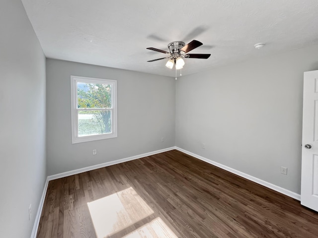 empty room featuring hardwood / wood-style flooring and ceiling fan