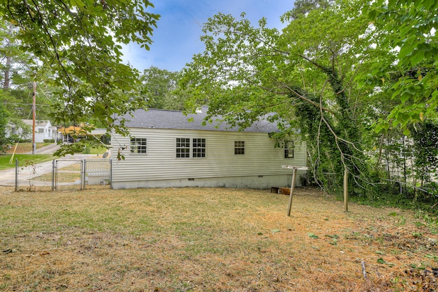 rear view of house with a lawn