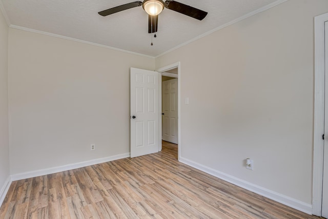 unfurnished room with light hardwood / wood-style floors, ceiling fan, and ornamental molding