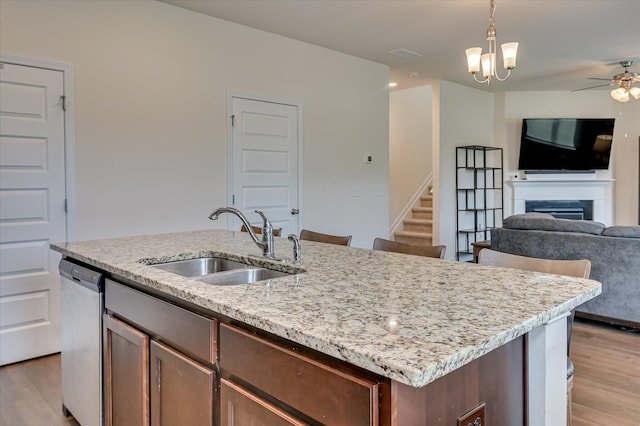 243 Quick Silver Ct, Graniteville, SC 29829 - kitchen with a fireplace, open floor plan, light wood-style flooring, and dishwasher