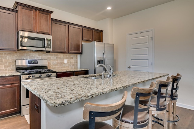 243 Quick Silver Ct, Graniteville, SC 29829 - kitchen with appliances with stainless steel finishes, light wood-style floors, backsplash, and recessed lighting