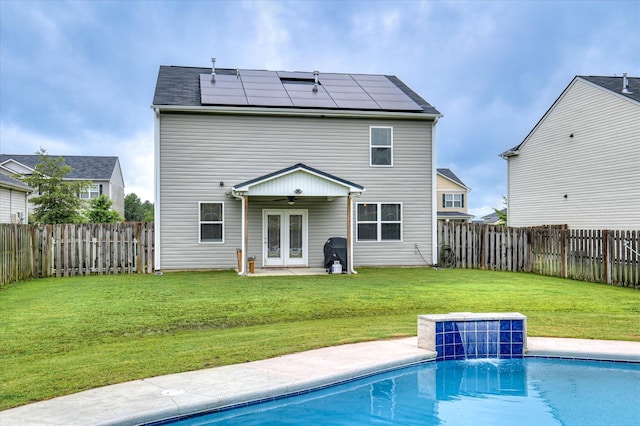 243 Quick Silver Ct, Graniteville, SC 29829 - rear view of property featuring ceiling fan, solar panels, a fenced backyard, a patio, and french doors