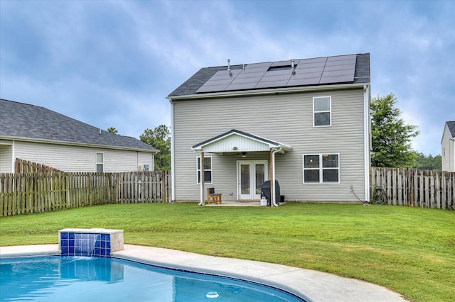 243 Quick Silver Ct, Graniteville, SC 29829 - back of house featuring solar panels, ceiling fan, a fenced backyard, a patio, and french doors
