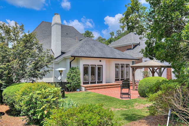 820 Barrett Ln, Augusta, GA 30909 - back of property featuring roof with shingles, a patio area, a gazebo, a chimney, and a yard