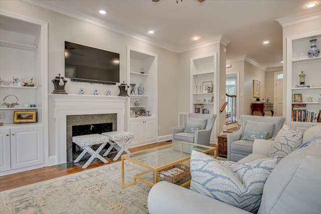 820 Barrett Ln, Augusta, GA 30909 - living area with wood finished floors, built in shelves, ornamental molding, a fireplace with flush hearth, and recessed lighting