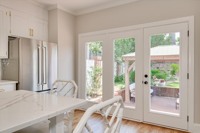 820 Barrett Ln, Augusta, GA 30909 - dining area featuring plenty of natural light, light wood-style flooring, crown molding, and french doors