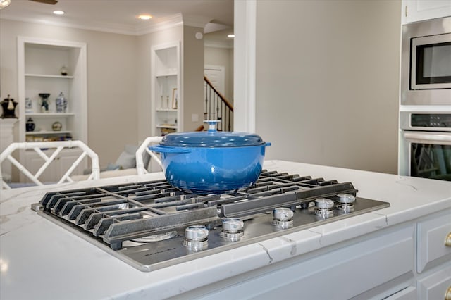 820 Barrett Ln, Augusta, GA 30909 - kitchen view of appliances with stainless steel finishes, crown molding, white cabinets, and recessed lighting