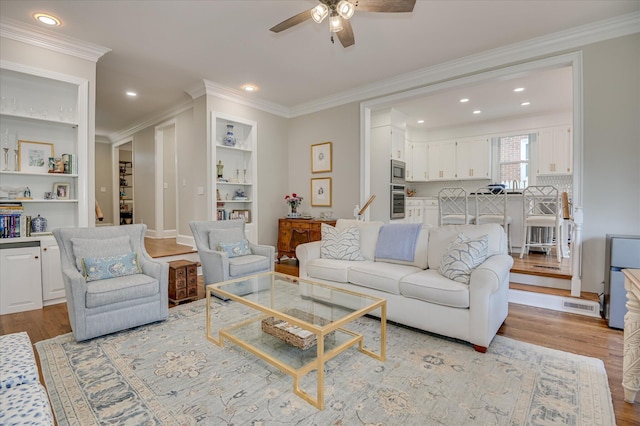 820 Barrett Ln, Augusta, GA 30909 - living area featuring ceiling fan, light wood-style flooring, built in shelves, ornamental molding, and recessed lighting