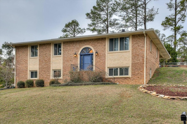 bi-level home featuring a front yard