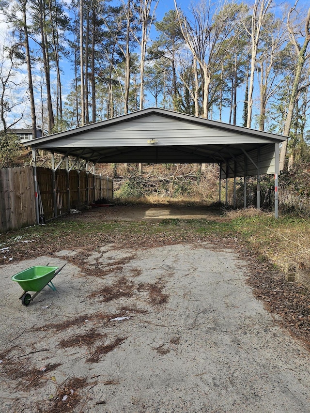 view of parking / parking lot featuring a carport