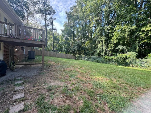 view of yard featuring a deck and cooling unit