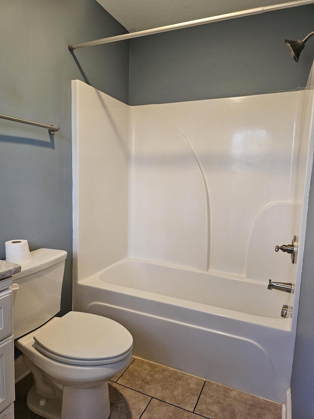 full bathroom with tile patterned floors, toilet, vanity, and tub / shower combination