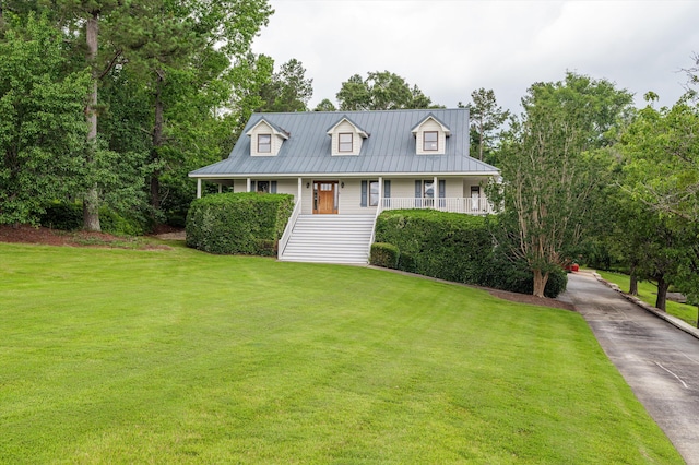 922 Windmill Ln, Evans, GA 30809 - cape cod-style house featuring a porch, a front lawn, and metal roof