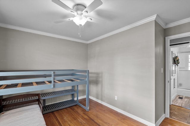 2872 Ga Highway 102, Wrens, GA 30833 - bedroom featuring hardwood / wood-style flooring, ceiling fan, and ornamental molding