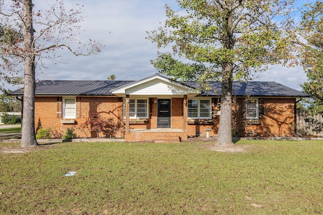 single story home with a porch and a front yard